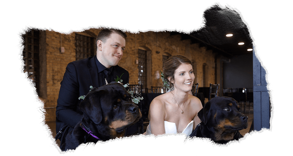 Bride and groom with their two dogs at their wedding venue in Duluth.