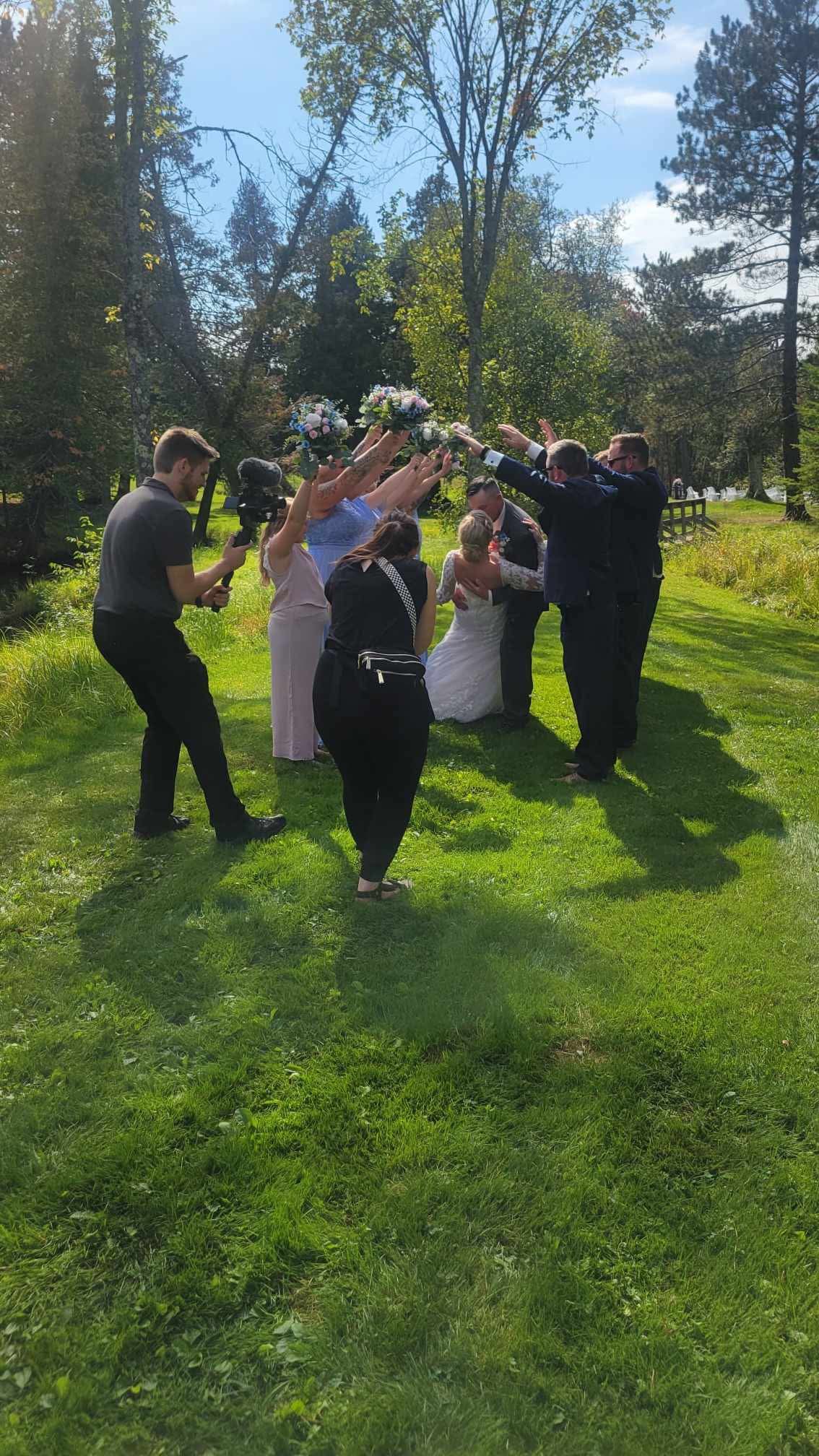 A behind the scenes shot of our wedding videographer working side-by-side with the photographer